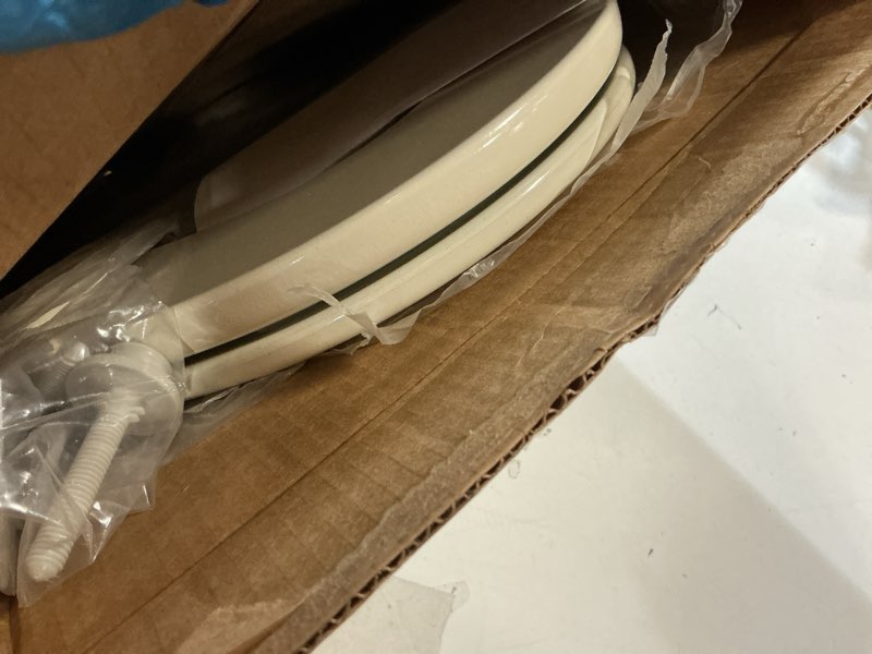 Condition photo showing As Is for bemis elongated enameled wood toilet seat in biscuit with easy•clean? hinge