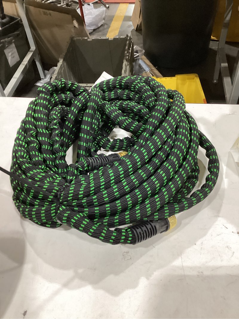 Condition photo showing As Is for flexi hose with 8 function nozzle, 50ft - lightweight expandable garden hose, no-kink flexibility, 3/4 inch solid brass fittings and double latex core - black and green green 50ft