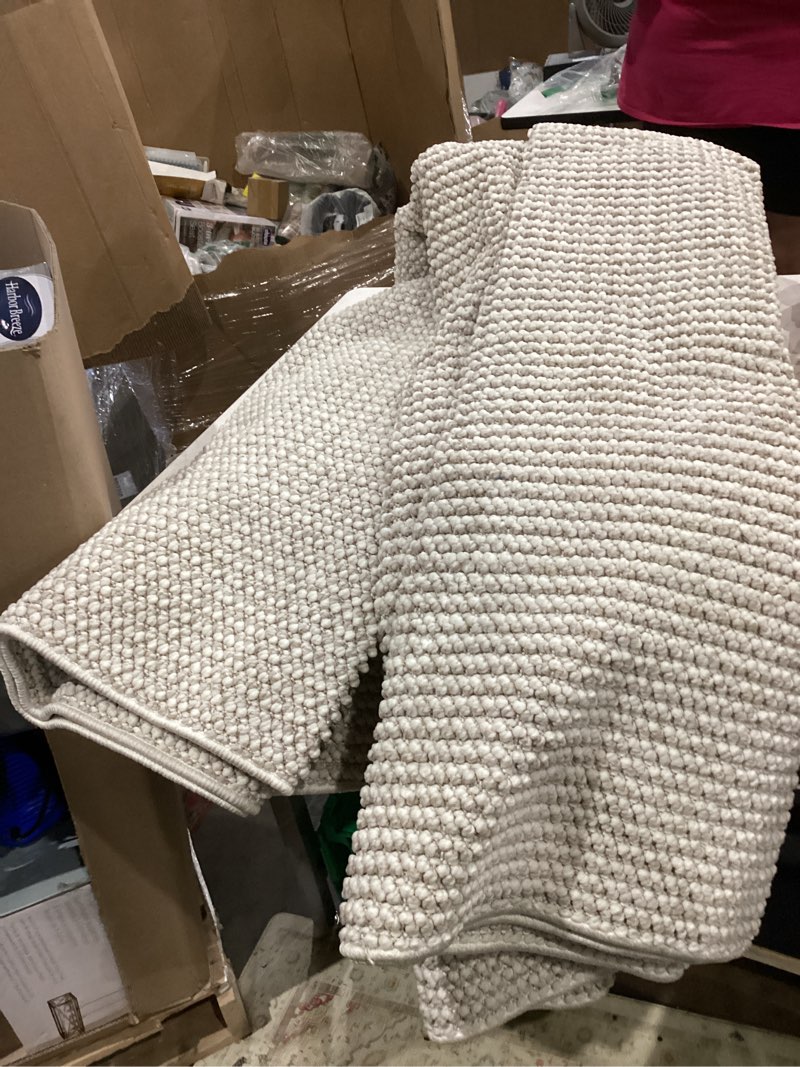 Condition photo showing Good Condition for  style selections milo 7 x 10 (ft) loomed polyester ivory rectangular indoor solid spot clean only