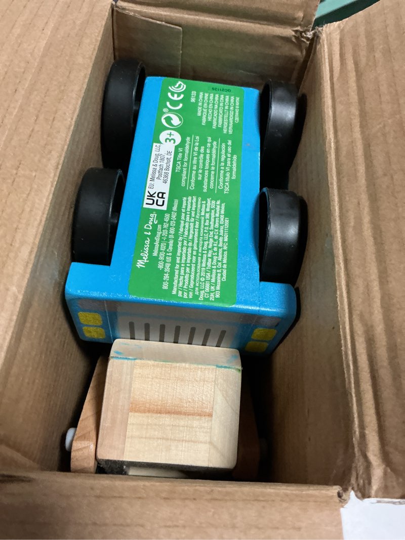 Condition photo showing As Is for Melissa & Doug Mega Race-Car Carrier - Wooden Tractor and Trailer with 6 Unique Race Cars Frustration-Free Packaging