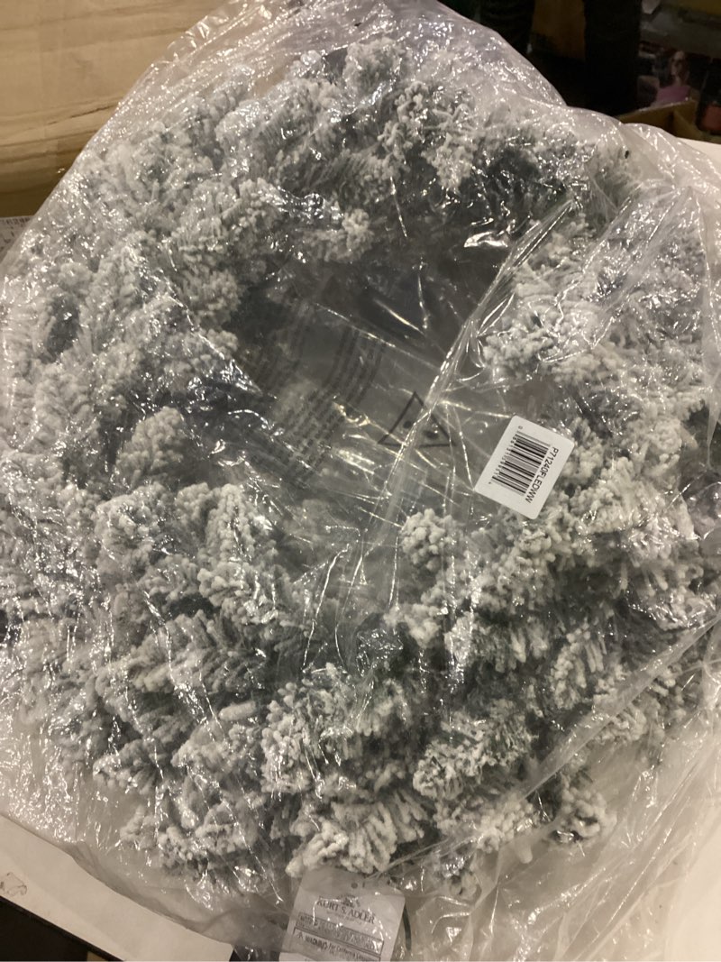 this is an artificial christmas wreath with a flocked "snow" finish.  