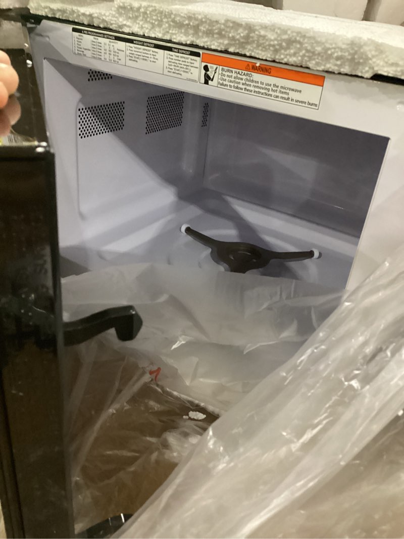 Condition photo showing Good Condition for *not tested, damage on top*black+decker em031mb11 digital microwave oven with turntable push-button door, child safety lock, 1000w, 1.1cu.ft, black & stainless steel, 1.1 cu.ft 1.1 cu. ft.