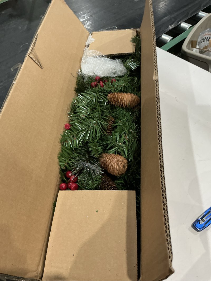 Condition photo showing Good Condition for national tree company 9 ft pre-lit crestwood spruce artificial christmas garland, christmas decoration with glitter, pinecones, red berries, 50 clear lights, 180 tips, green plug in tree
