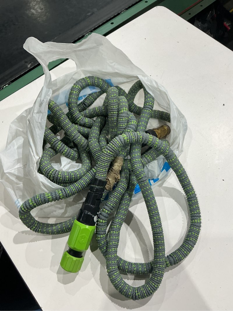 Condition photo showing As Is for hydrotech 50 ft expandable burst-proof garden hose, 5/8 in diameter | patented force control technology delivers lightweight, kink-free flexibility, compact storage and dependable durability.