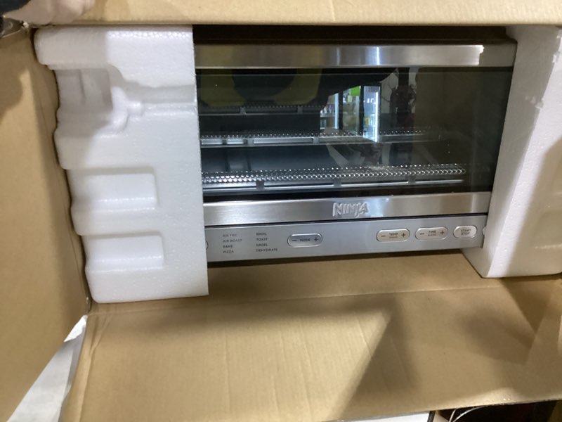 Condition photo showing New/Like New for Ninja Air Fryer Toaster Oven Combo | 8-in-1 Functionality | Flip Up & Away for Storage Space | Air Fry Basket, Sheet Pan, Wire Rack & Removable Crumb Tray |1800 Watt | Stainless Steel | SP151 Stainless Premium 8-in-1 Flip Oven