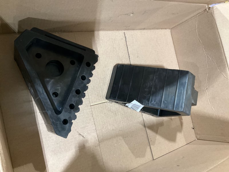 Condition photo showing As Is for MAXXHAUL 70472 Solid Rubber Heavy Duty Black Wheel Chock 2-Pack, 8" x 4" x 6"