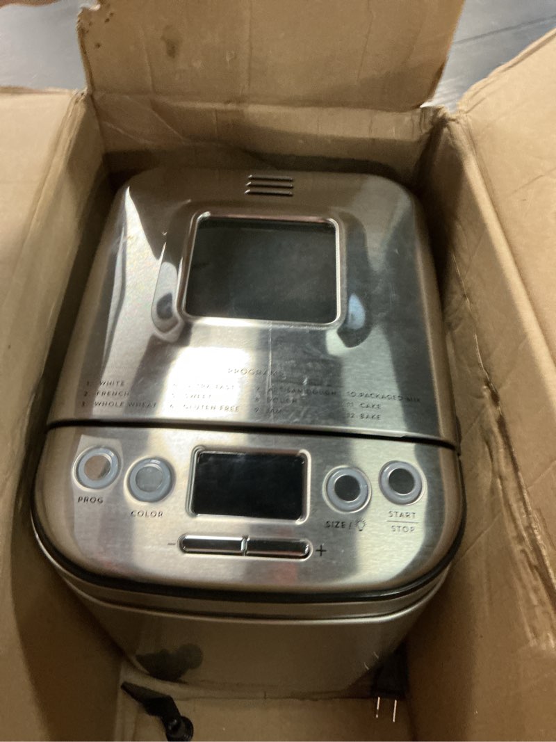 Condition photo showing As Is for cuisinart bread maker machine, stainless steel automatic bread machine with 12 menu options, 3 loaf sizes up to 2 lb., 3 crust colors, removable nonstick baking pan & kneading paddle, cbk-110nas