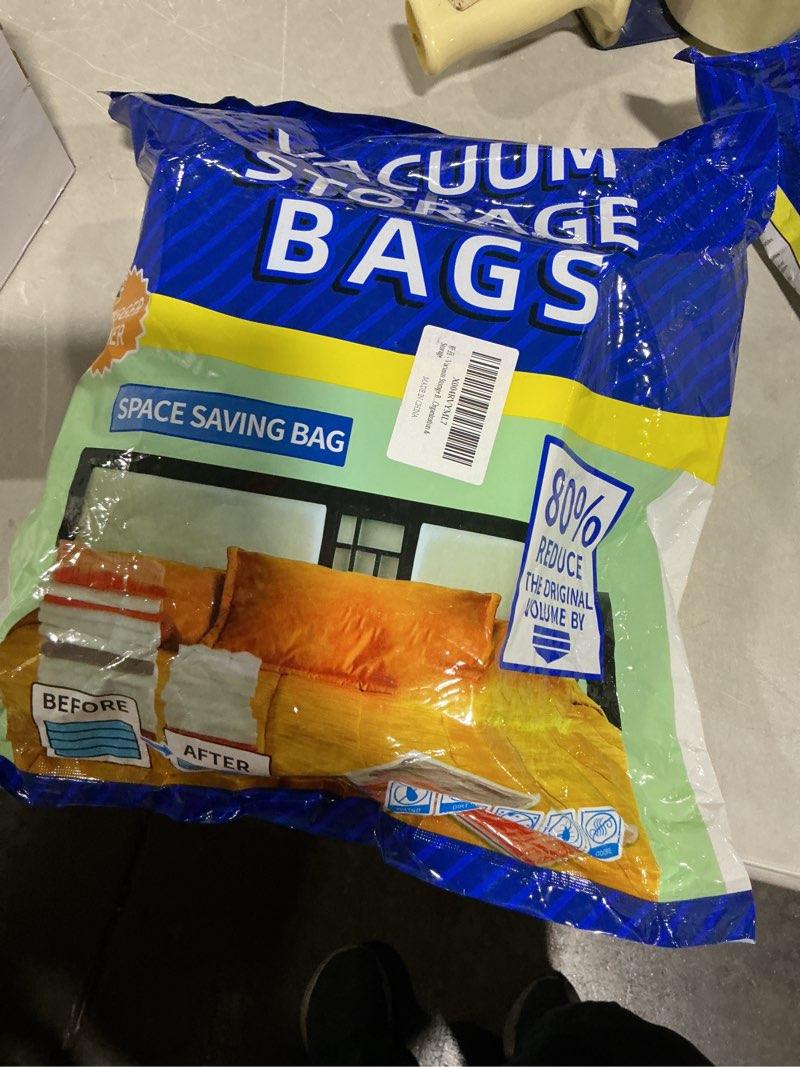 Condition photo showing As Is for Amazon Basics Vacuum Compression Space Saving Storage Bags with Hand Pump, similar to stock bags 