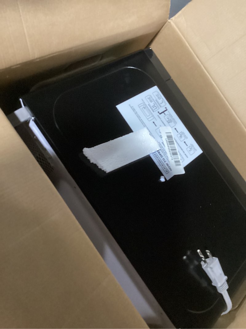 Condition photo showing New/Like New for black+decker em720cb7 digital microwave oven with turntable push-button door, child safety lock, 700w, stainless steel, 0.7 cu.ft 0.7 cu. ft.