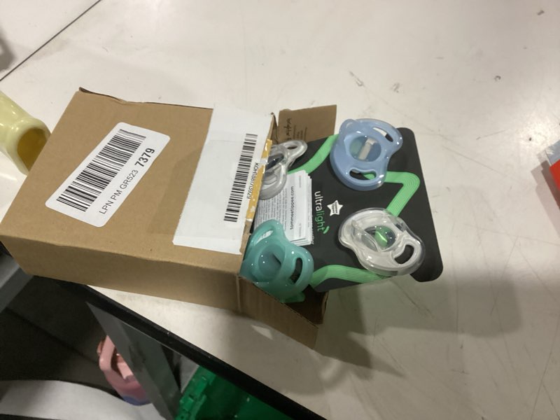 Condition photo showing New/Like New for tommee tippee ultra-light silicone pacifier, 0-6 months, symmetrical one-piece design, bpa-free silicone binkies, blue/green/clear, pack of 4 0-6 month (pack of 4)