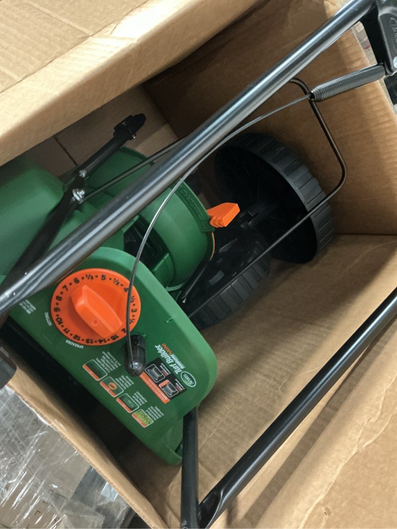 Condition photo showing As Is for Scotts Turf Builder EdgeGuard Mini Broadcast Spreader for Seed, Weed and Feed, Fertilizer, Salt, Ice Melt, Push Spreader Holds up to 5,000 sq.ft. Product