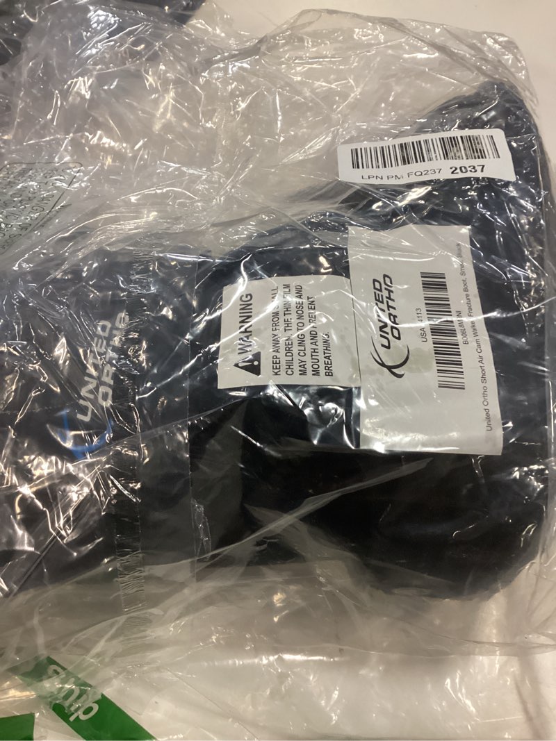 Condition photo showing New/Like New for united ortho short air cam walker fracture boot, small, black black small boot