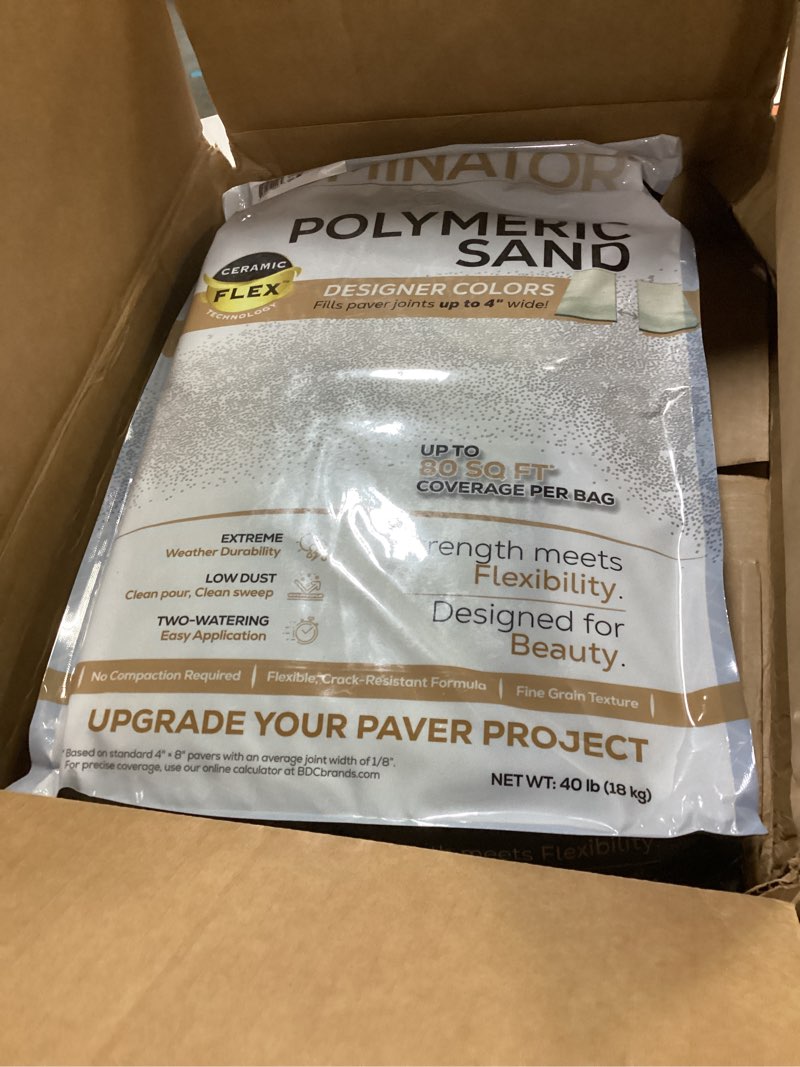 Condition photo showing New/Like New for 40 pound charcoal gray dominator polymeric sand with revolutionary ceramic flex technology for stabilizing paver joints/gaps, 1/8” up to 4”, professional grade results