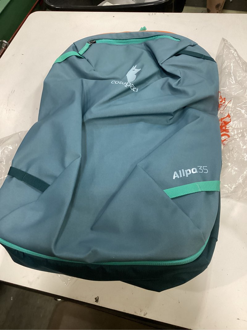 Condition photo showing New/Like New for cotopaxi allpa 35l travel pack, blue spruce and abyss blue spruce/abyss