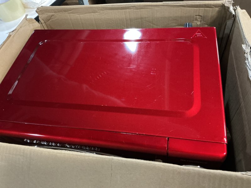 Condition photo showing As Is for nostalgia retro countertop microwave oven, 0.9 cu. ft. 800-watts with led digital display, child lock, easy clean interior, cu.ft, red retro classic 0.9 cu. ft. red