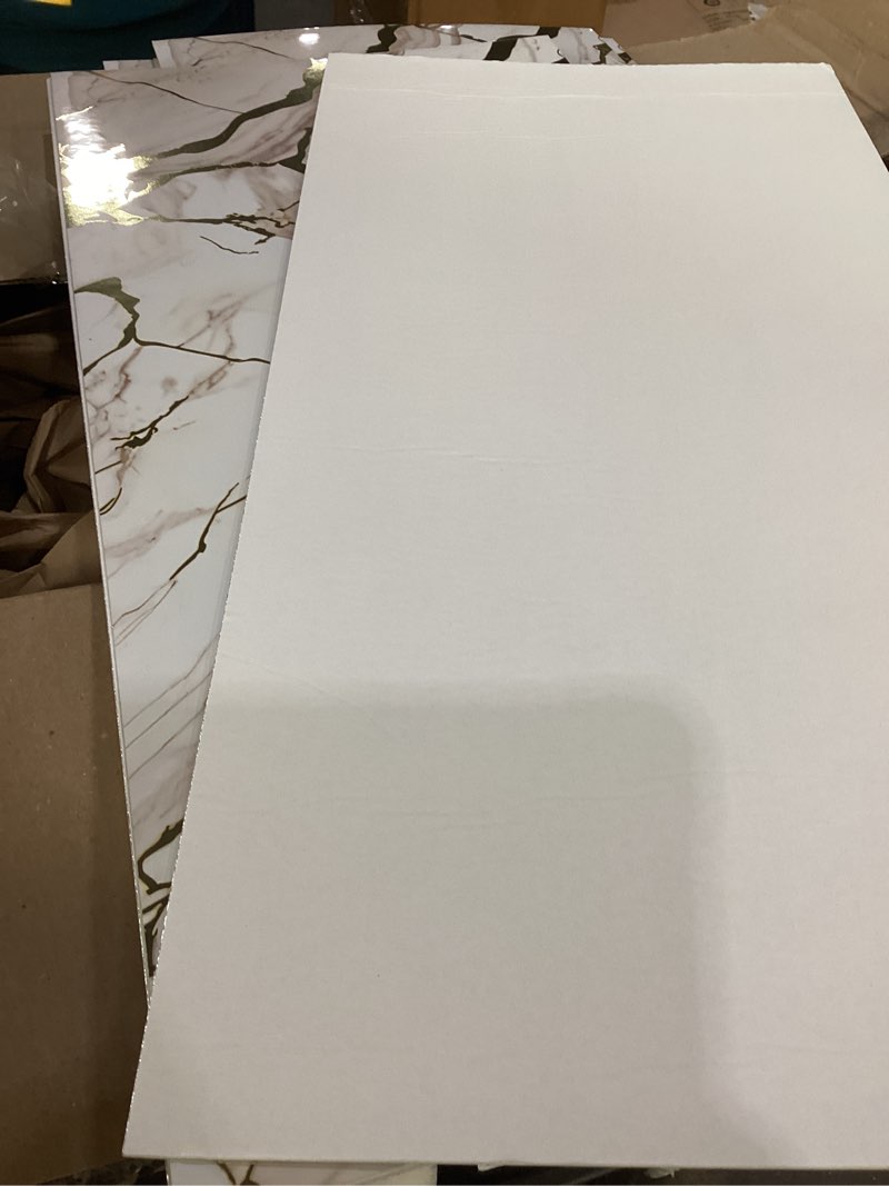 Condition photo showing Good Condition for 9 stick on wall marble panels 