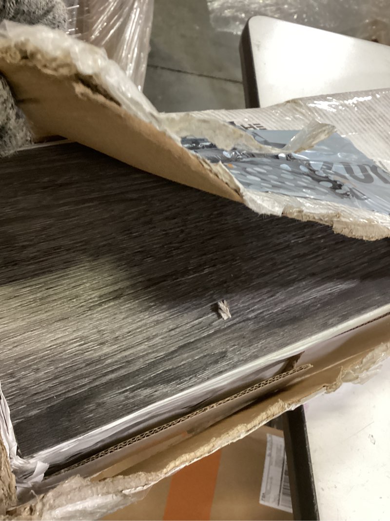 Condition photo showing As Is for inmozata peel and stick floor tile vinyl flooring, waterproof vinyl plank flooring 36-pack 54 sq.ft wood grain self adhesive peel and stick flooring for bedroom, living room, kitchen, rv(deep gray) deep gray 36 pcs