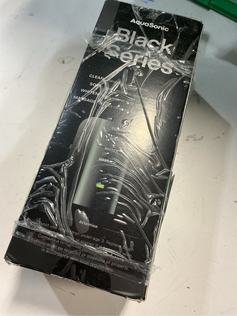 Condition photo showing As Is for aquasonic black series ultra whitening toothbrush – ada accepted electric toothbrush- 8 brush heads & travel case – 40,000 vpm electric motor & wireless charging - 4 modes w smart timer 1 count (pack of 1)