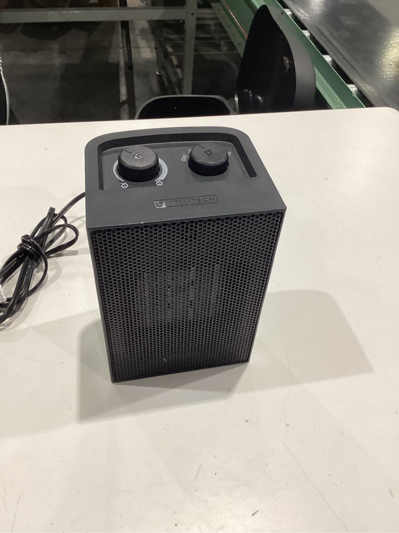 Condition photo showing As Is for  utilitech 1500 -watt ceramic compact personal indoor electric space heater with thermostat