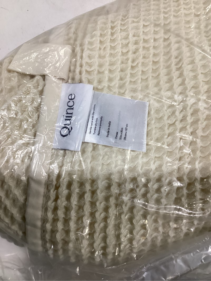 Condition photo showing Good Condition for quince cream colored throw 