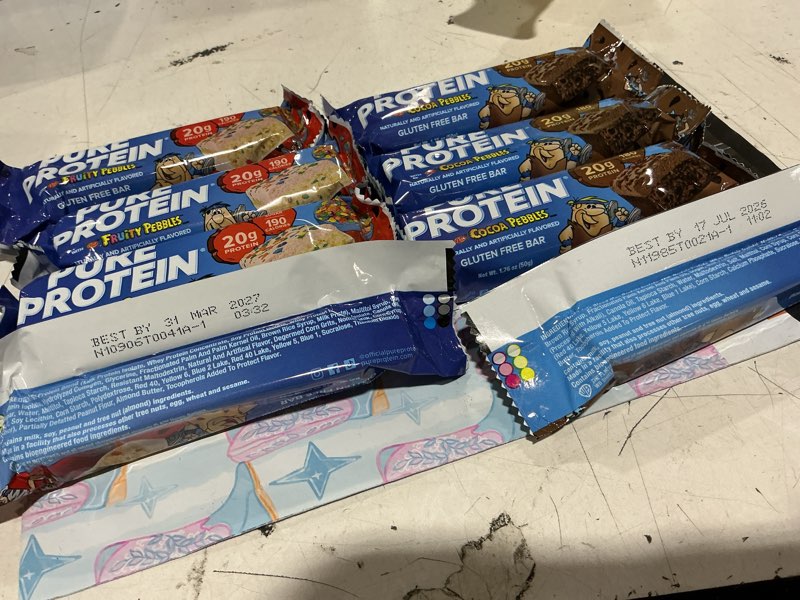 Condition photo showing As Is for (bb: 07/17/2026) 2 4 packs of pure protein bars. flavors are fruity pebbles & coca pebbles.