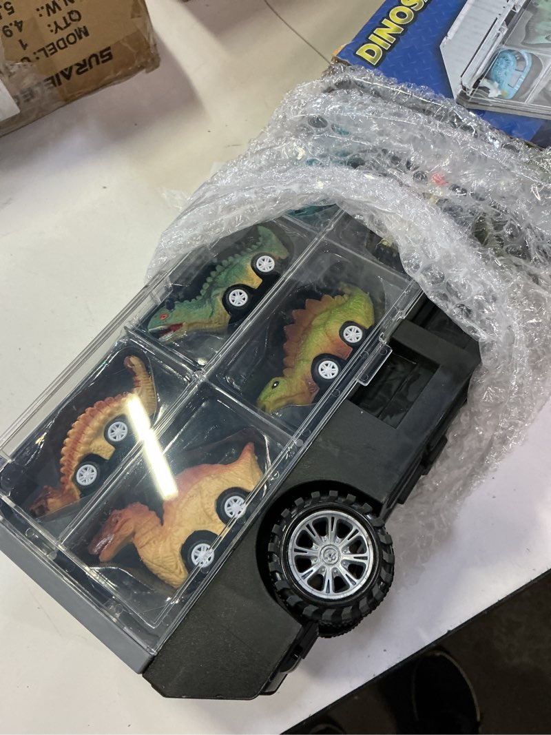 Condition photo showing New/Like New for joyin 13 in 1 dinosaur toys for kids 3-5, transport dinosaur carrier truck with 12 pull back cars, toddler toys 3-4? birthday gifts for 3 4 5+ year old boys tyrannosaurus truck