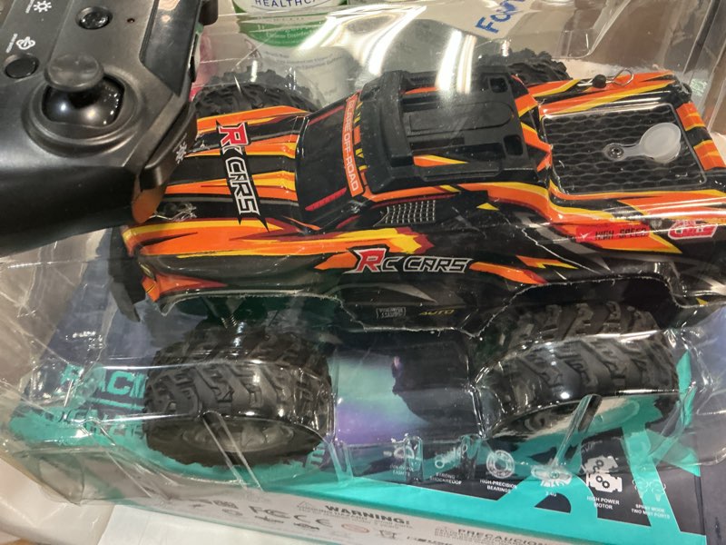 Condition photo showing New/Like New for remote control car for boys, 1:16 scale all terrain rc cars,high speed 25km/h fast car with colorful led light and spray, 2x1300mah rechargeable battery rc truck, toy car gift for teen boys girl kids 2023-orange
