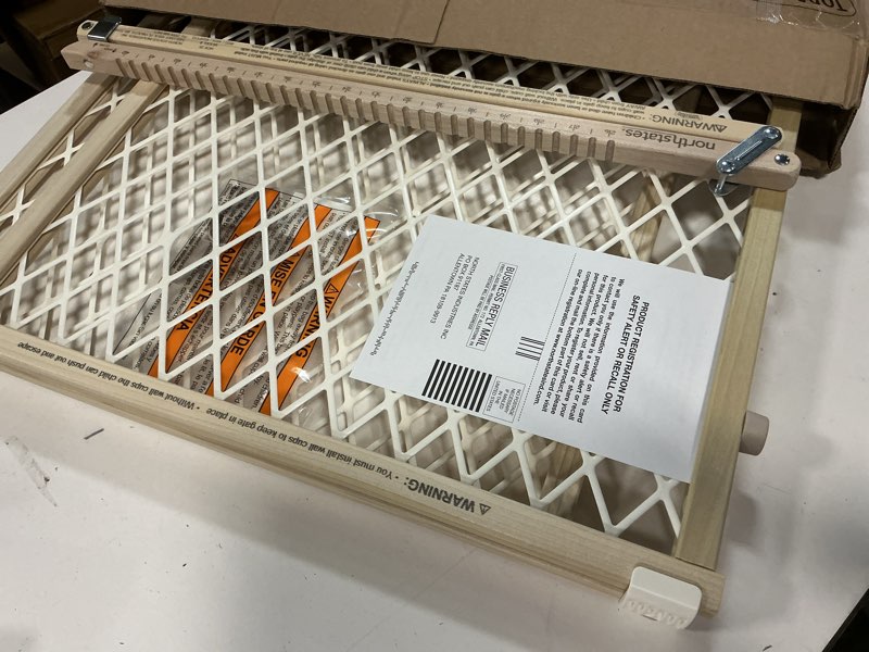 Condition photo showing As Is for Toddleroo by North States Diamond Mesh Wooden Baby Gate: 26.5"- 42" Wide. Pressure Mounted Baby Gate for Doorway. (23" Tall, Sustainable Hardwood)