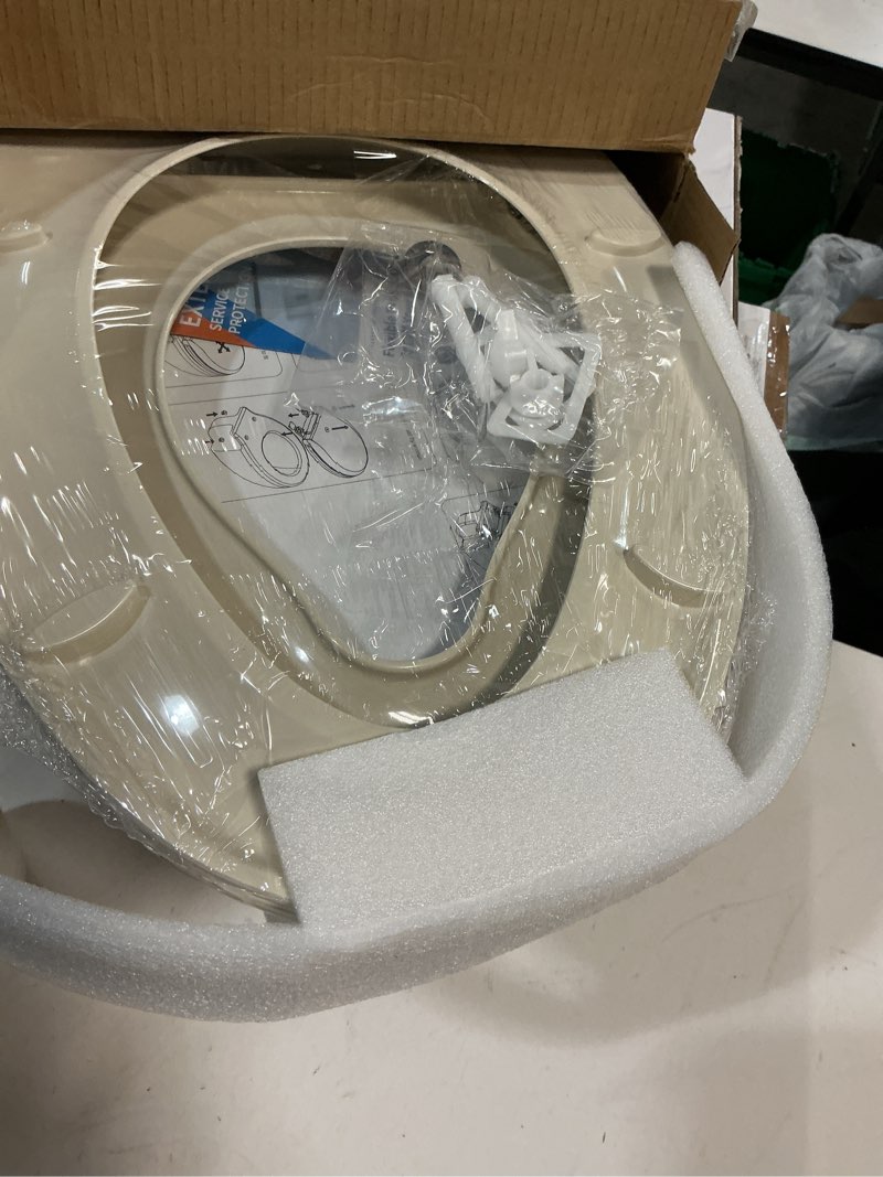 Condition photo showing New/Like New for toilet seat, elongated toilet seat with toddler seat built in, potty training toilet seat elongated fits both adult and child, with slow close and magnets- elongated almond almond elongated with toddler seat