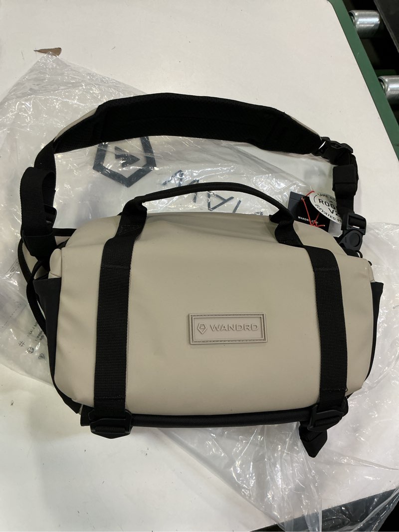 Condition photo showing New/Like New for WANDRD All New ROGUE Sling V2: Weather-Resistant Everyday Carry Bag with Lightning Fast Access, Customizable Interior, Laptop Sleeve & Tripod Pocket – Minimalist Crossbody for Travel, EDC & Creators Yuma Tan 6l