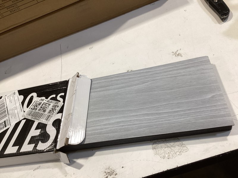 Condition photo showing Good Condition for 30 Sq.Ft. Peel and Stick Vinyl Floor Tiles 36" x 6" Wood Look Planks, 20 PackWaterproof Self-Adhesive Flooring Tiles, DIY for Renter, Kitchen, Living Room, RV, Light Grey 36x6 Inch Light Grey 20