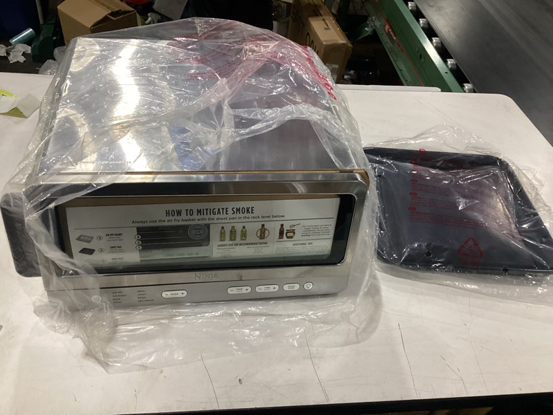 Condition photo showing Good Condition for **untested** ninja air fryer toaster oven combo | 8-in-1 functionality | flip up & away for storage space | air fry basket, sheet pan, wire rack & removable crumb tray |1800 watt | stainless steel | sp151 8-in-1 flip oven stainless
