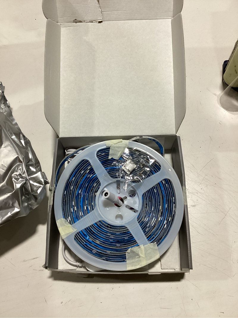 Condition photo showing As Is for 50ft. multi-color led light strip - gray - 50