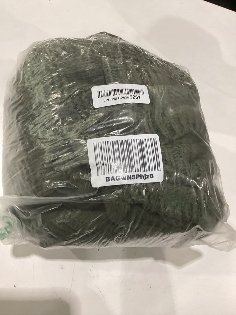Condition photo showing As Is for green woven blanket