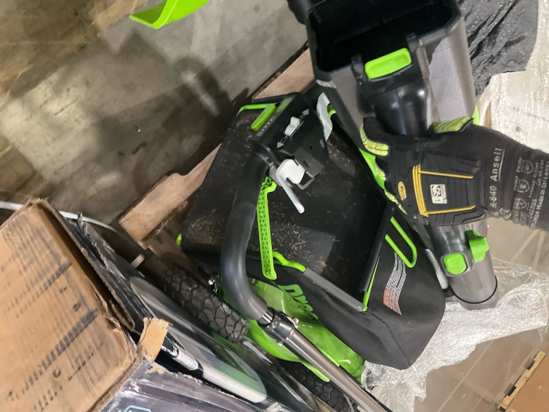 Condition photo showing As Is for greenworks yard kit with mower, trimmer and blower