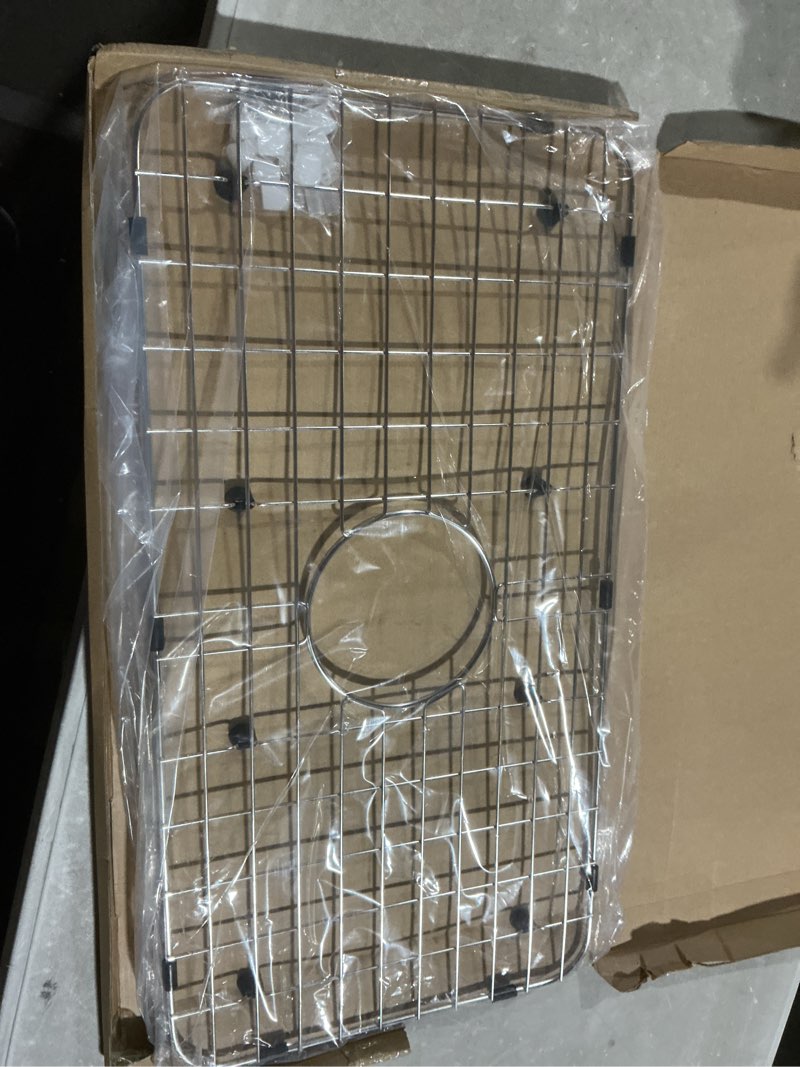 Condition photo showing Good Condition for serene valley sink bottom grid 24-1/8" x 12-5/8", centered drain with corner radius 1-1/2", sink protector nlw2412c