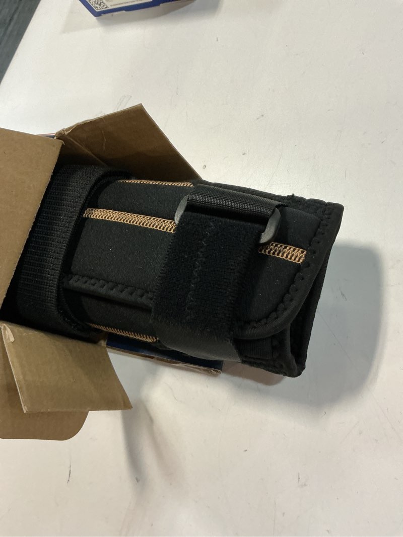 Condition photo showing Good Condition for rapid relief one size fits most wrist brace in black