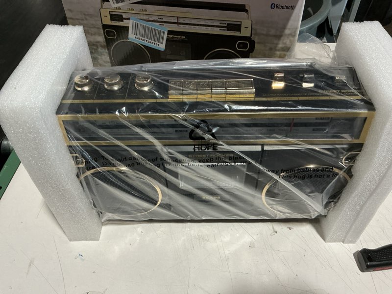 Condition photo showing New/Like New for ion audio 1980s-style portable bluetooth boombox am/fm radio cassette player recorder, vu meters, usb recording, dual full-range high bass speakers (gold edition)