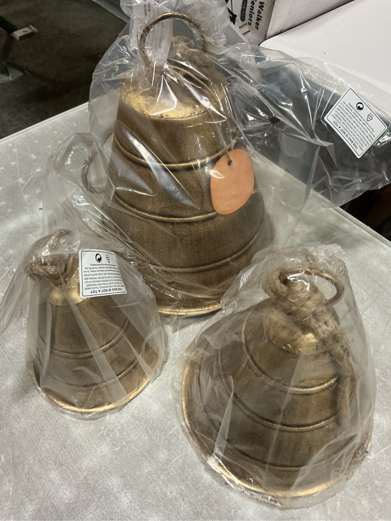 Condition photo showing New/Like New for Deco 79 Metal Indoor Outdoor Decorative Cow Bells Tibetan Inspired Meditation Bell with Jute Hanging Rope, Set of 3 Cow Bell 10', 8', 5'H, Bronze Bronze Set of 3: 10", 8", 5"H