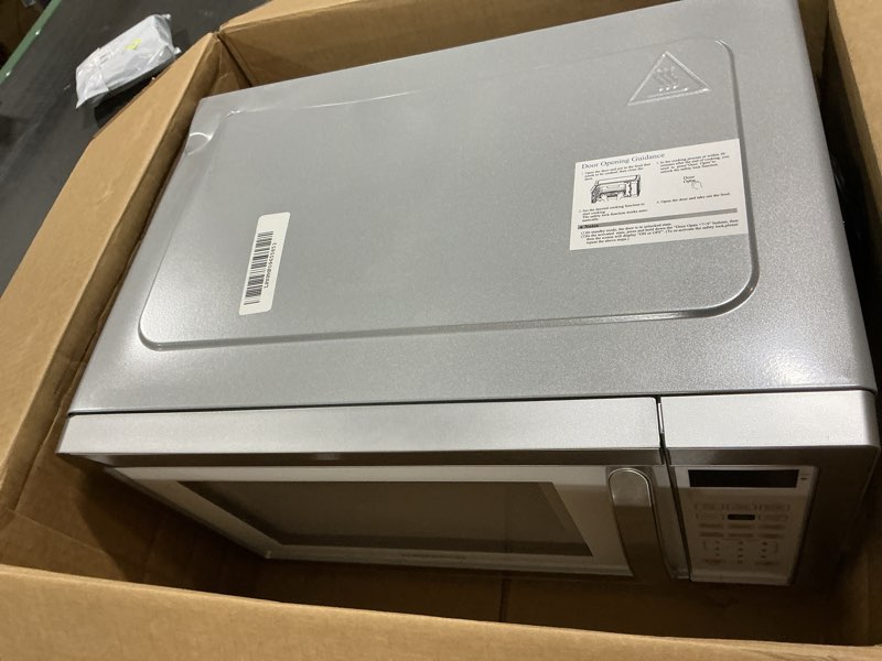 Condition photo showing As Is for Farberware 1.1 Cu. Ft. Countertop Microwave Oven – 1000 Watts Power, Auto Cook Settings, Defrost, Easy Clean and Child Safety Lock - White Platinum 1.1 Cu. Ft. White Platinum