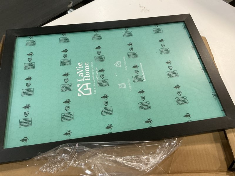 Condition photo showing item condition for lavie home 14x22 picture frame black poster frame, stable and sturdy frame and polished plexiglass, horizontal and vertical format of the walls 1 pack 14x22 black