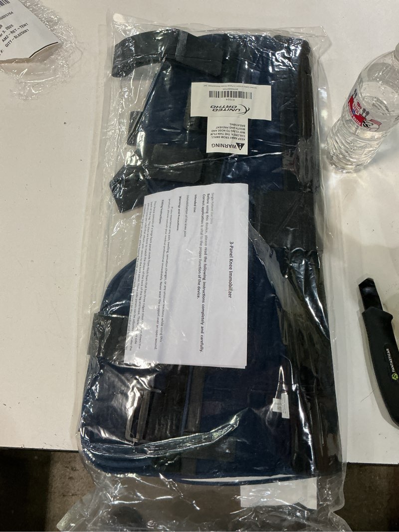 Condition photo showing New/Like New for United Ortho 61024 3-Panel Knee Immobilizer, 24" Size Navy 24" Immobilizer