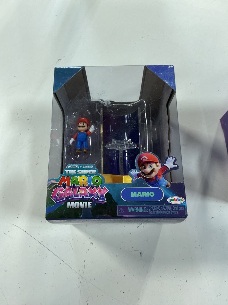Condition photo showing New/Like New for the super mario galaxy movie – 1.5” figure with star launcher accessory – mario