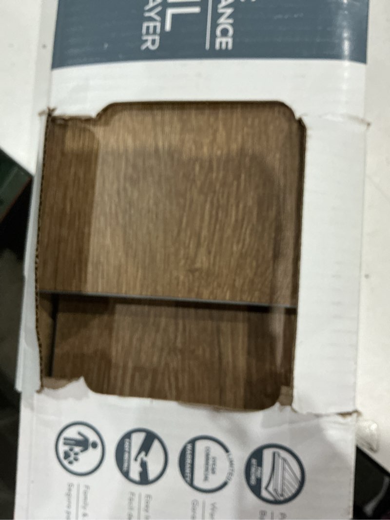 Condition photo showing As Is for (used)style selections brown 6-in wide x 4-2/5-mm thick waterproof interlocking luxury vinyl plank flooring (22.17-sq ft)