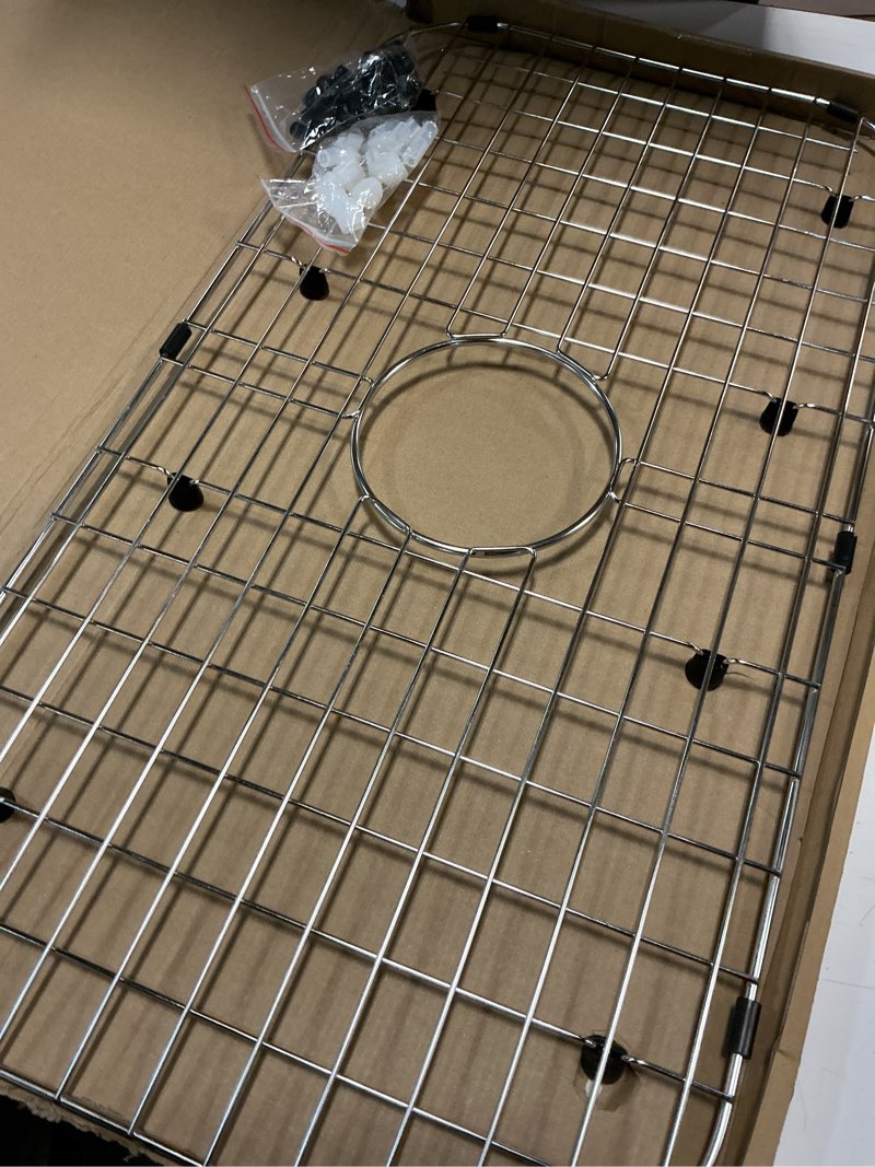 Condition photo showing Good Condition for Serene Valley Sink Protector Grid 26-1/16" x 14-1/16", Centered Drain with Corner Radius 3-1/2", 304 Stainless Steel Material NLW2614C
