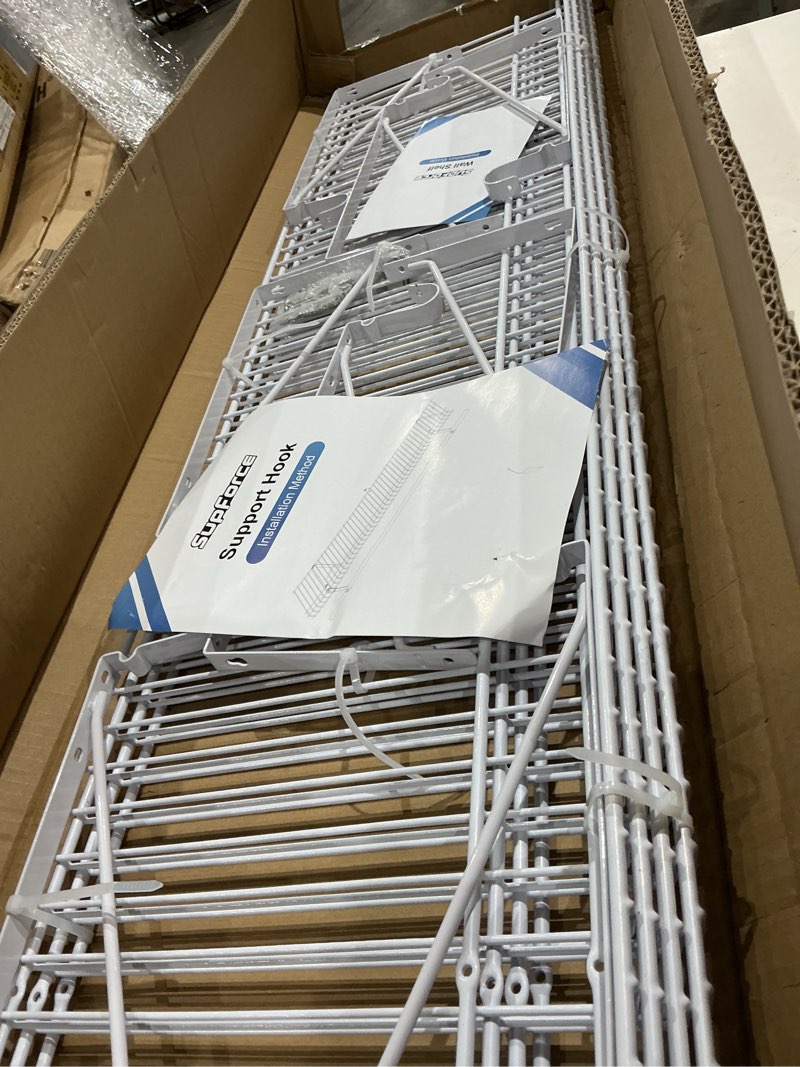 Condition photo showing Good Condition for 4-pack wire closet shelving with triangular brackets, 150 lb capacity | reinforced triangular brackets, built-in rod holders, 150 lb capacity, soft rubber coating, wall mounted, 4ft x 12in, 4-pack 4 4ft x 12in no rod 4ft x 12in