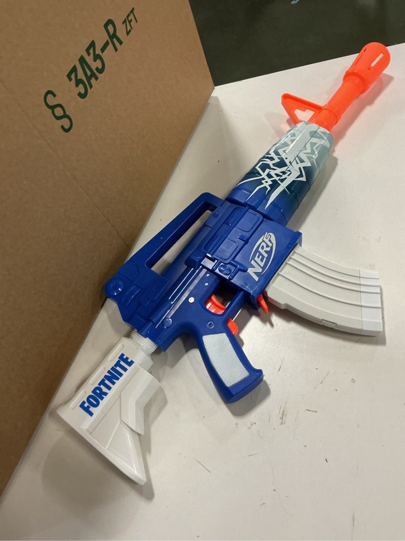 Condition photo showing Good Condition for Nerf Fortnite Blue Shock Blaster, 10-Dart Clip, 10 Elite Nerf Darts, Includes Bonus Code to Unlock The Beat Wrap in The Game, Motorized Dart Blaster