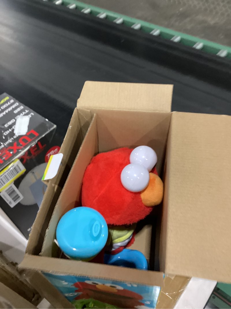 Condition photo showing Good Condition for SESAME STREET Potty Time Elmo 12-Inch Sustainable Plush Stuffed Animal, Sounds and Phrases, Potty Training Tool, Officially Licensed Kids Toys for Ages 18 Month by Just Play, Medium