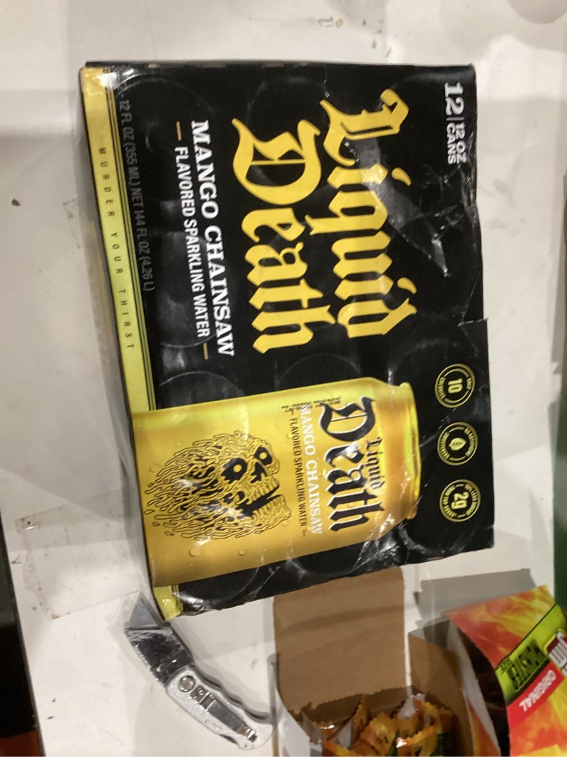 Condition photo showing New/Like New for Liquid Death, Mango Chainsaw, Soda-Flavored Sparkling Water, 12-Pack (12oz Cans), Low Sugar, Huge Flavor & No Artificial Sweeteners Mango Chainsaw 12 Fl Oz (Pack of 12)
