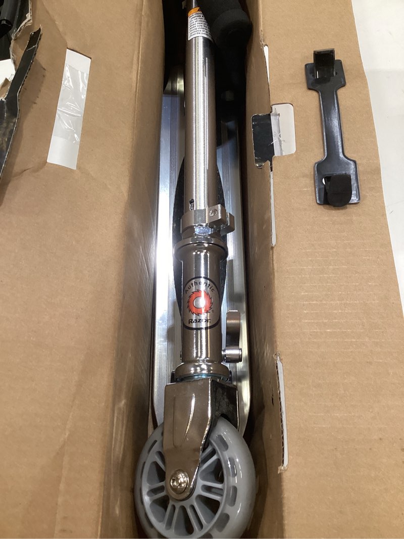 Condition photo showing As Is for razor a kick scooter for kids - lightweight, foldable, aluminum frame, and adjustable handlebars clear/black